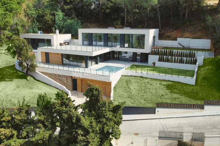 Contemporary villa in a gated community Santa Maria de Llorell with private beach