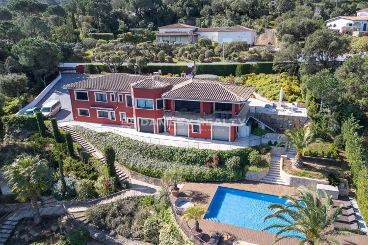 Luxury exclusive villa with a spacious garden, private pool, and padel court, offering breathtaking sea and mountain views.