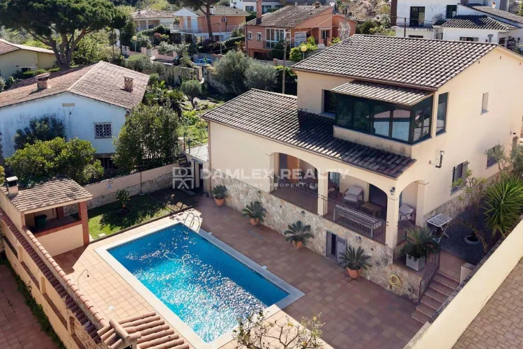 Delightful Mediterranean villa with lush garden, private pool, and charming views, within walking distance to Sant Pol beach